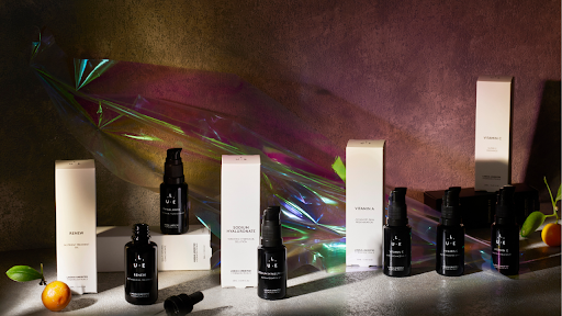LaGaia Unedited skincare products displayed with bottles and boxes on a styled surface with soft lighting and natural accents